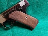 COLT - WOODSMAN. 1ST SERIES. 6.5" BARREL. NEAR MINT IN ORIGINAL BOX W-PAPERS. MFG. IN 1936 - .22 LR - 11 of 23