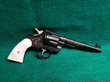 Colt - OFFICERS MODEL. HEAVY BARREL. 6". BLUED. ENGRAVED BY VALENYA. REAL PEARL GRIPS. BEAUTIFUL! MFG. IN 1941 - .38 Spl