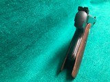 COLT-BULLSEYE MATCH TARGET WOODSMAN W/ ORIGINAL MAGAZINE-MFG.1941-.22 L.R.-BRIGHT FINISH AND FACTORY ELEPHANT EAR GRIPS- GREAT CONDITION APROX. 85% - 4 of 25
