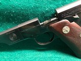 COLT-BULLSEYE MATCH TARGET WOODSMAN W/ ORIGINAL MAGAZINE-MFG.1941-.22 L.R.-BRIGHT FINISH AND FACTORY ELEPHANT EAR GRIPS- GREAT CONDITION APROX. 85% - 19 of 25