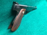 COLT-BULLSEYE MATCH TARGET WOODSMAN W/ ORIGINAL MAGAZINE-MFG.1941-.22 L.R.-BRIGHT FINISH AND FACTORY ELEPHANT EAR GRIPS- GREAT CONDITION APROX. 85% - 3 of 25