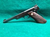 COLT-BULLSEYE MATCH TARGET WOODSMAN W/ ORIGINAL MAGAZINE-MFG.1941-.22 L.R.-BRIGHT FINISH AND FACTORY ELEPHANT EAR GRIPS- GREAT CONDITION APROX. 85% - 24 of 25