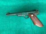 COLT-BULLSEYE MATCH TARGET WOODSMAN W/ ORIGINAL MAGAZINE-MFG.1941-.22 L.R.-BRIGHT FINISH AND FACTORY ELEPHANT EAR GRIPS- GREAT CONDITION APROX. 85% - 25 of 25