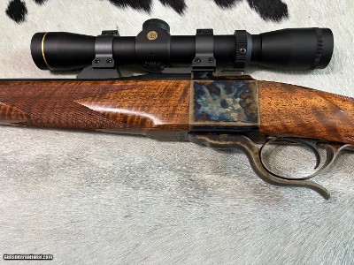 Dakota Model 10-
7X57mm, highly figured stock and case color, Leupold ultralight scope, Talley rings