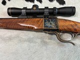 Dakota Model 10-
7X57mm, highly figured stock and case color, Leupold ultralight scope, Talley rings