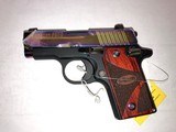 Sig Sauer P238 380acp Slide covered in plastic wood grips - 2 of 2