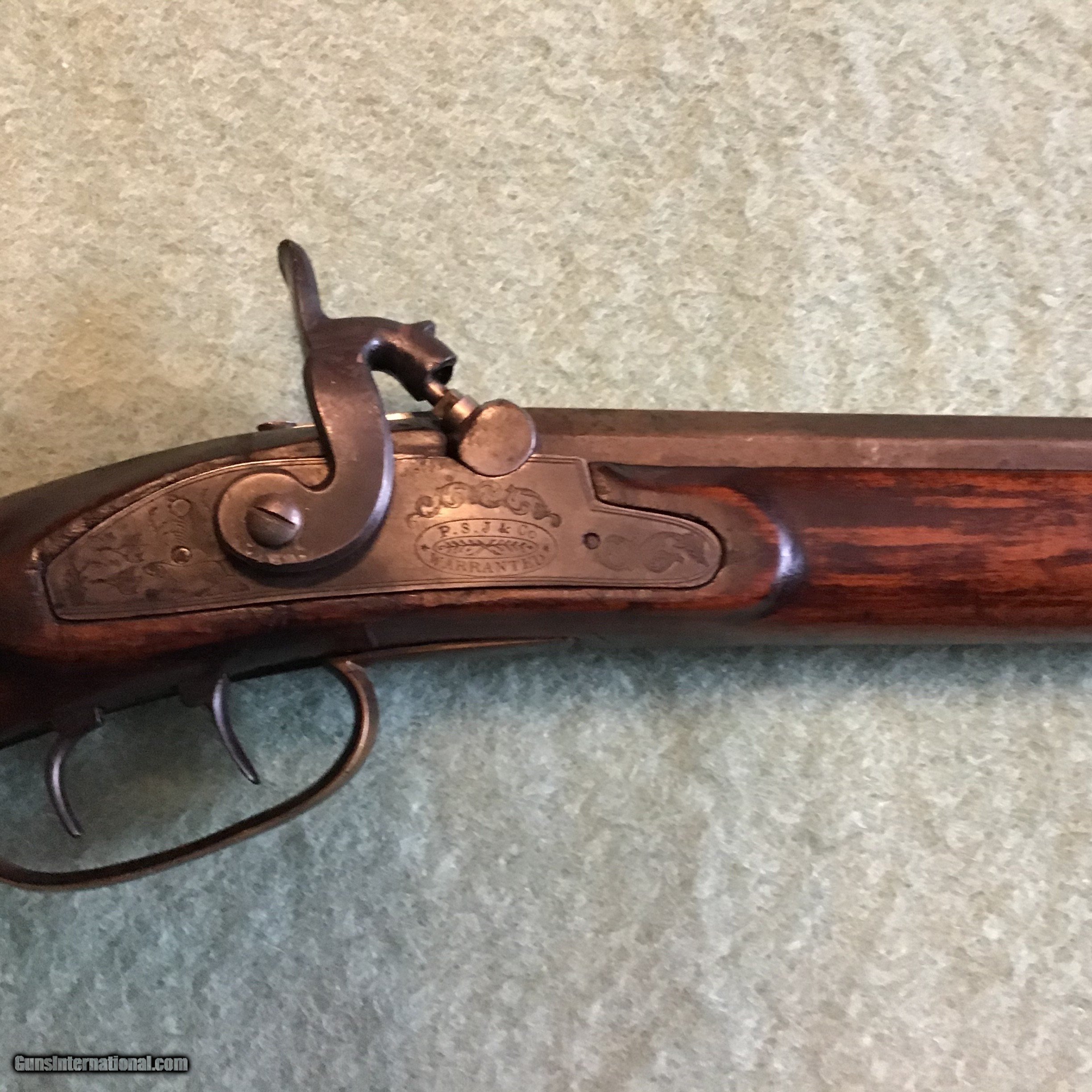 Henry marked half stock percussion 38 caliber rifle.