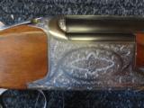 Browning B 27 Deluxe Game( Grade II )
12 ga 28" M/F English scroll engraved mint - 2 of 11