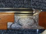 Browning B 27 Deluxe Game( Grade II )
12 ga 28" M/F English scroll engraved mint - 1 of 11