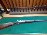 687 CLASSIC 20ga 30in a beautiful dark wood with a P.O.W. grip - 1 of 12