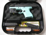 GLOCK 43, 9mm, Gently Used, Robin Egg Blue frame, Streamlight TLR-6, 3 mags, Trijicon site - 1 of 13