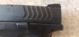 USED SPRINGFIELD XDM 9MM WITH ORIGINAL CASE, SPEED LOADER, EXTRA BUTT GAURDS,LOCK , HOLSTER,EXTRACLIP , DUAL CLIP HOLDER - 10 of 21