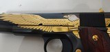 Used Un-fired Colt 1911 45 acp
American Eagle in Gold and Blue with wooden display case - 10 of 25