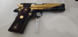 Used Un-fired Colt 1911 45 acp
American Eagle in Gold and Blue with wooden display case - 12 of 25