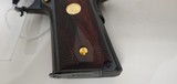 Used Un-fired Colt 1911 45 acp
American Eagle in Gold and Blue with wooden display case - 7 of 25