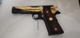 Used Un-fired Colt 1911 45 acp
American Eagle in Gold and Blue with wooden display case - 6 of 25