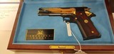 Used Un-fired Colt 1911 45 acp
American Eagle in Gold and Blue with wooden display case - 3 of 25