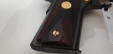 Used Un-fired Colt 1911 45 acp
American Eagle in Gold and Blue with wooden display case - 13 of 25