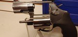 New Smith and Wesson Model 686 357 Magnum 2 1/2" barrel 7 round stainless black rubber grips in hard plastic case with manuals - 21 of 22