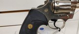 Used Colt Official Police 38 Special 4 3/4" barrelbobbed hammer very good condition stainless with black grips - 13 of 24
