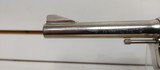 Used Colt Official Police 38 Special 4 3/4" barrelbobbed hammer very good condition stainless with black grips - 7 of 24
