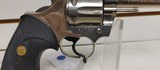 Used Colt Official Police 38 Special 4 3/4" barrelbobbed hammer very good condition stainless with black grips - 14 of 24