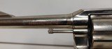 Used Colt Official Police 38 Special 4 3/4" barrelbobbed hammer very good condition stainless with black grips - 8 of 24