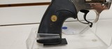 Used Colt Official Police 38 Special 4 3/4" barrelbobbed hammer very good condition stainless with black grips - 12 of 24