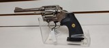 Used Colt Official Police 38 Special 4 3/4" barrelbobbed hammer very good condition stainless with black grips - 1 of 24