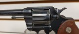 Used Colt Official Police 38 special 5" barrelblue with brown grips good condition - 1 of 19