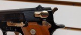 Used Smith and Wesson Model 39 4" barrel 9mm gold finish hardware (NO MAGAZINE)blue and gold with brown grips very good condition - 9 of 19