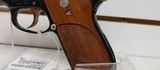 Used Smith and Wesson Model 39 4" barrel 9mm gold finish hardware (NO MAGAZINE)blue and gold with brown grips very good condition - 5 of 19