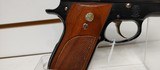 Used Smith and Wesson Model 39 4" barrel 9mm gold finish hardware (NO MAGAZINE)blue and gold with brown grips very good condition - 16 of 19