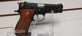 Used Smith and Wesson Model 39 4" barrel 9mm gold finish hardware (NO MAGAZINE)blue and gold with brown grips very good condition - 12 of 19