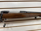 Used Savage 11030-06 wood stock with black receiver and barrel bore is clean good condition - 2 of 24