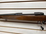 Used Savage 11030-06 wood stock with black receiver and barrel bore is clean good condition - 8 of 24