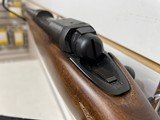 Used Savage 11030-06 wood stock with black receiver and barrel bore is clean good condition - 9 of 24