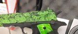 Used Iver Johnson G1911A145acp5" barrel Zombie Green Camo and Grips2 magazines hard plastic case lock manualvery good condition - 2 of 17