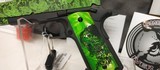 Used Iver Johnson G1911A145acp5" barrel Zombie Green Camo and Grips2 magazines hard plastic case lock manualvery good condition - 5 of 17
