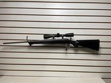 Used Ruger M77 Hawkeye 243 winchester23" barrelnikon buckmaster scope black synthetic stock good condition - 1 of 21