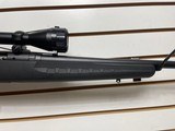 Used Savage Axis 243 win21" barrel bushnell 3x9-40 scope with covers black synthetic stock good condition - 18 of 24