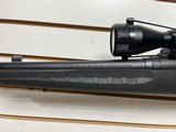 Used Savage Axis 243 win21" barrel bushnell 3x9-40 scope with covers black synthetic stock good condition - 23 of 24