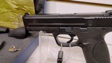 Lightly used smith & wesson M&P 9 4 1/4" barrel 2 mags grip adjuster manuals hard plastic case lock reduced - 9 of 18