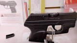 Used ruger LCP 2.5" barrel .380 cal crimson trace red dot built in soft holster lock manuals original box reduced - 14 of 20