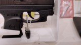 Used ruger LCP 2.5" barrel .380 cal crimson trace red dot built in soft holster lock manuals original box reduced - 16 of 20