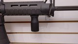 Used Bushmaster XM15-E2S 16" 5.56x.223 1 30 round magazine foregrip fixed stock very good condition - 18 of 24