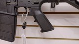 Used Bushmaster XM15-E2S 16" 5.56x.223 1 30 round magazine foregrip fixed stock very good condition
