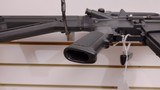 Used Bushmaster XM15-E2S 16" 5.56x.223 1 30 round magazine foregrip fixed stock very good condition - 24 of 24
