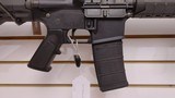 Used Bushmaster XM15-E2S 16" 5.56x.223 1 30 round magazine foregrip fixed stock very good condition - 19 of 24