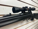 Used Remington Model 597 22 mag 19" barrel black synthetic stock and forearm golden antler scope good condition - 4 of 20